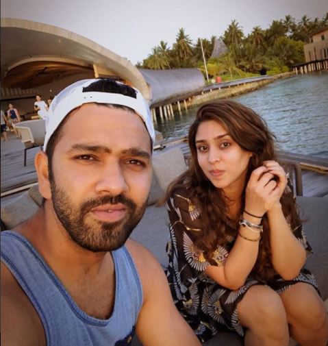 Rohit sharma chilling with her wife near ocean
