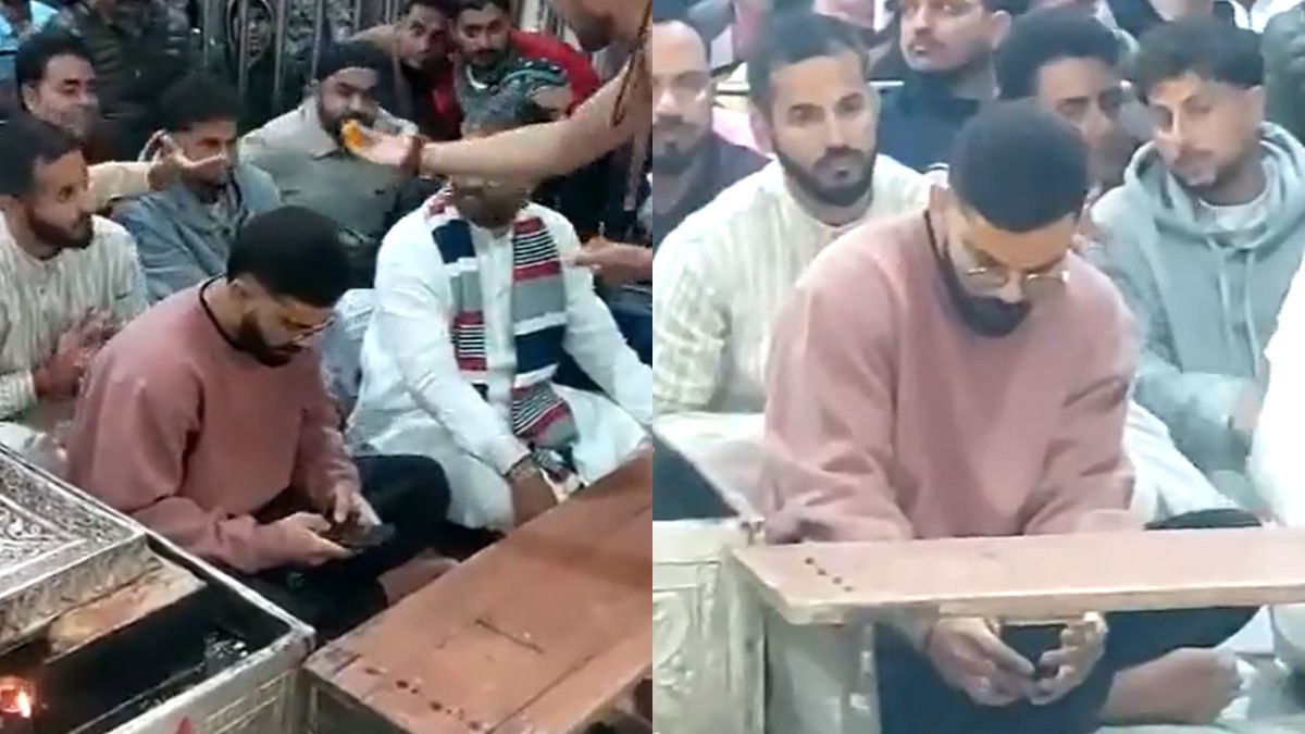 Virat Kohli was spotted using his phone even during the Bhasma Aarti ceremony, leading fans to call him a "phone addict" and troll him.