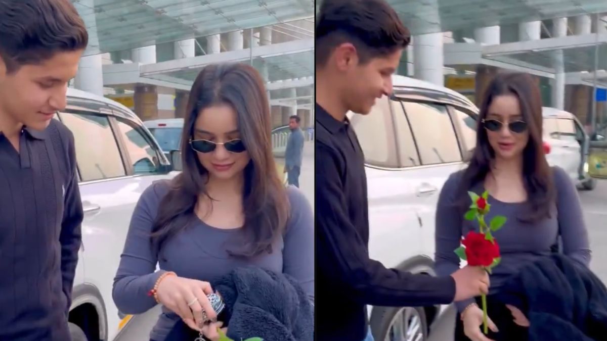 A boy gave Sara Tendulkar a rose at the airport.